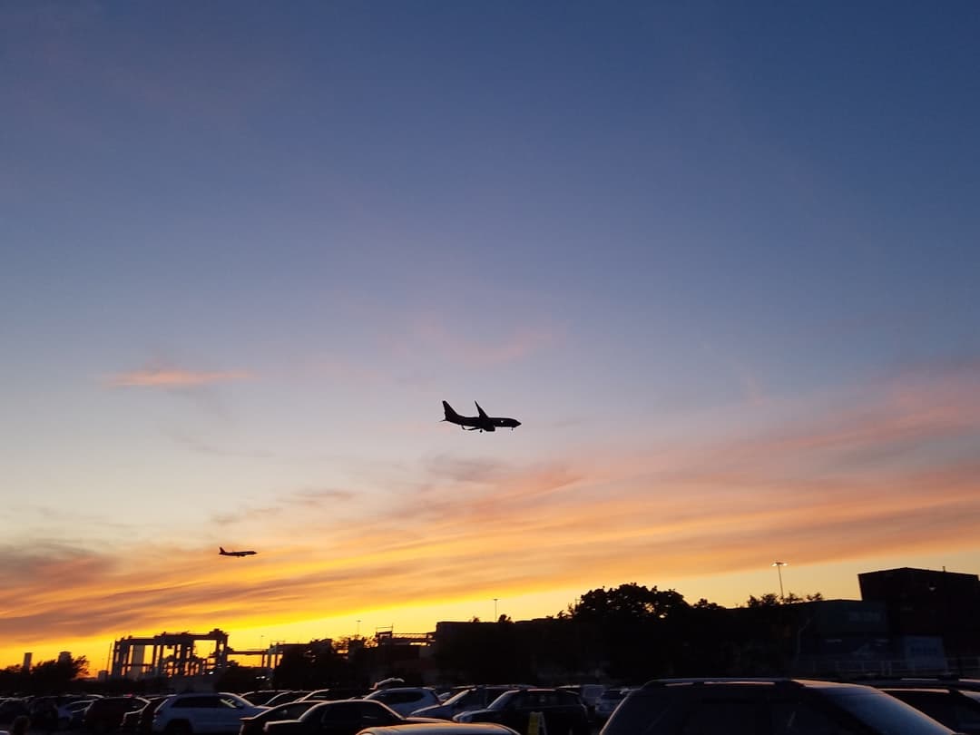 airplane under clear blue sky — Photo by something magical on Unsplash
