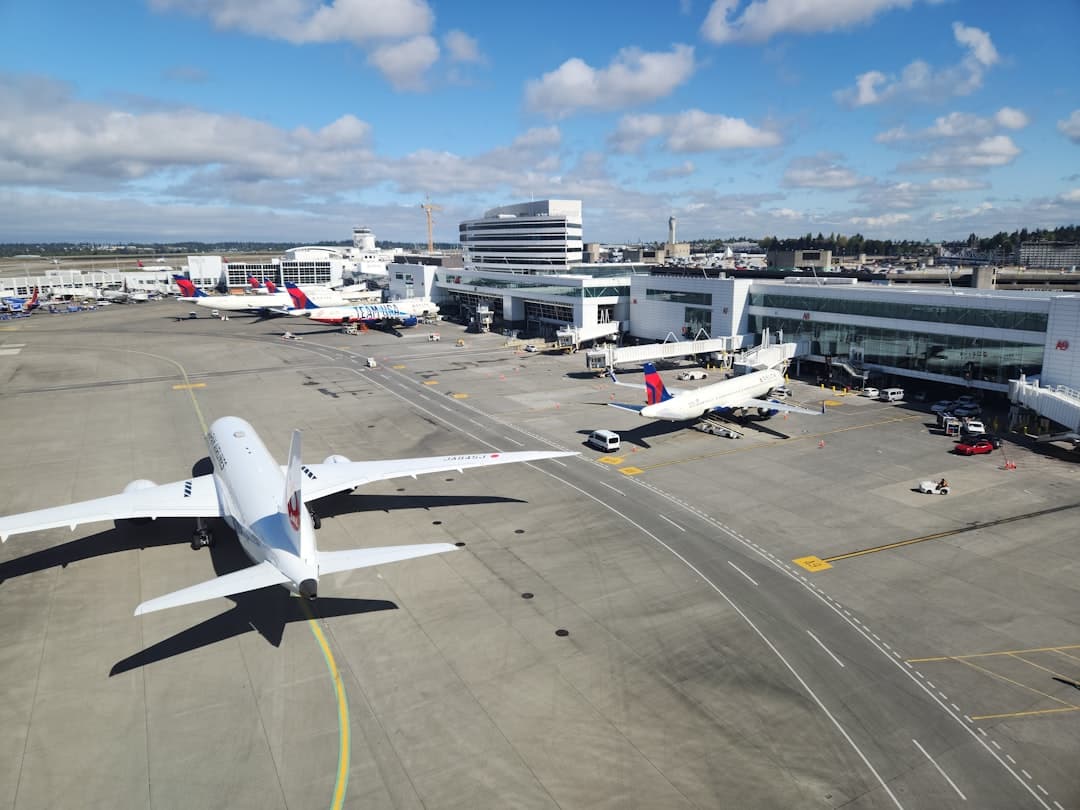 A large jetliner sitting on top of an airport tarmac — Photo by Zoshua Colah on Unsplash
