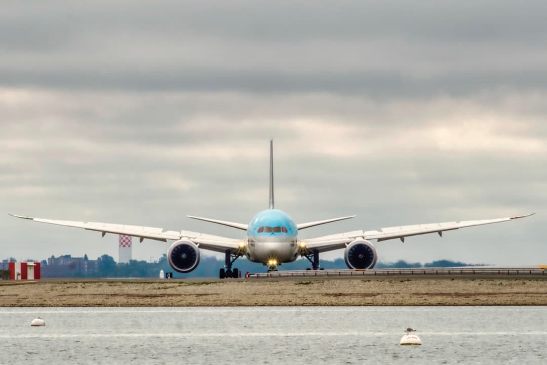 a large jetliner sitting on top of an airport runway — Photo by Yuval Zukerman on Unsplash