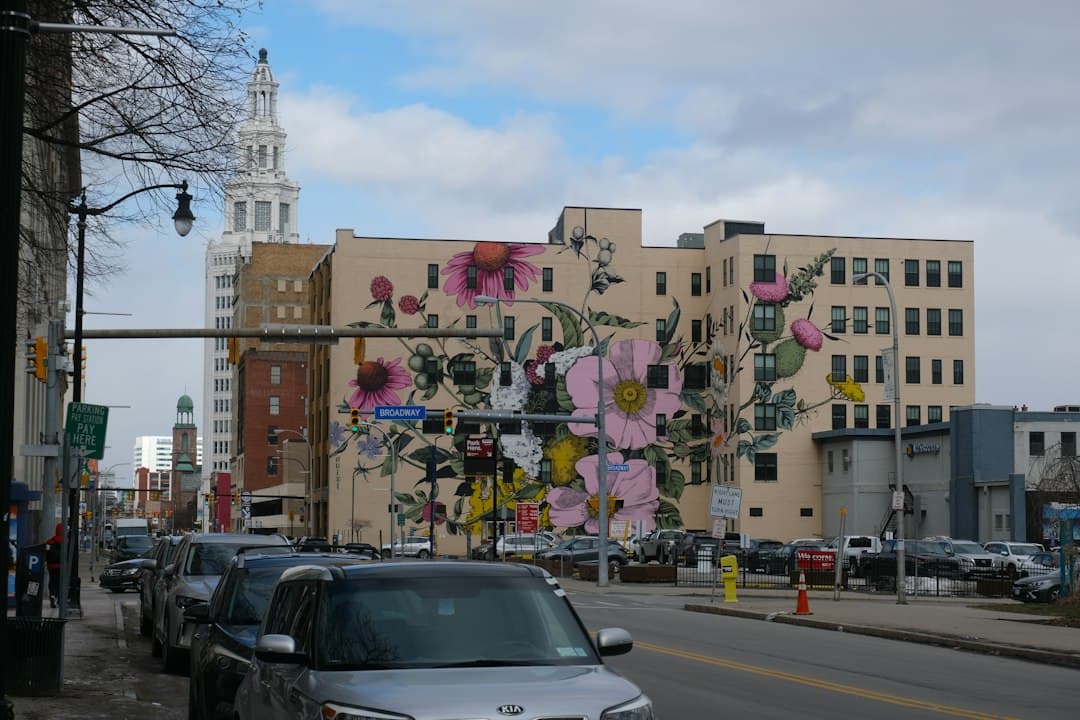 City street with floral mural on a building — Photo by Anil Baki Durmus on Unsplash