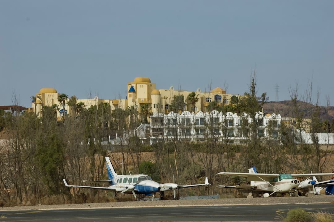 white and blue airplane on the ground during daytime — Photo by Altruistas Org on Unsplash