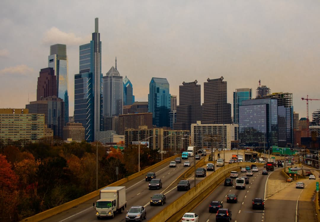 a busy highway with lots of traffic and tall buildings — Photo by Jimmy Woo on Unsplash