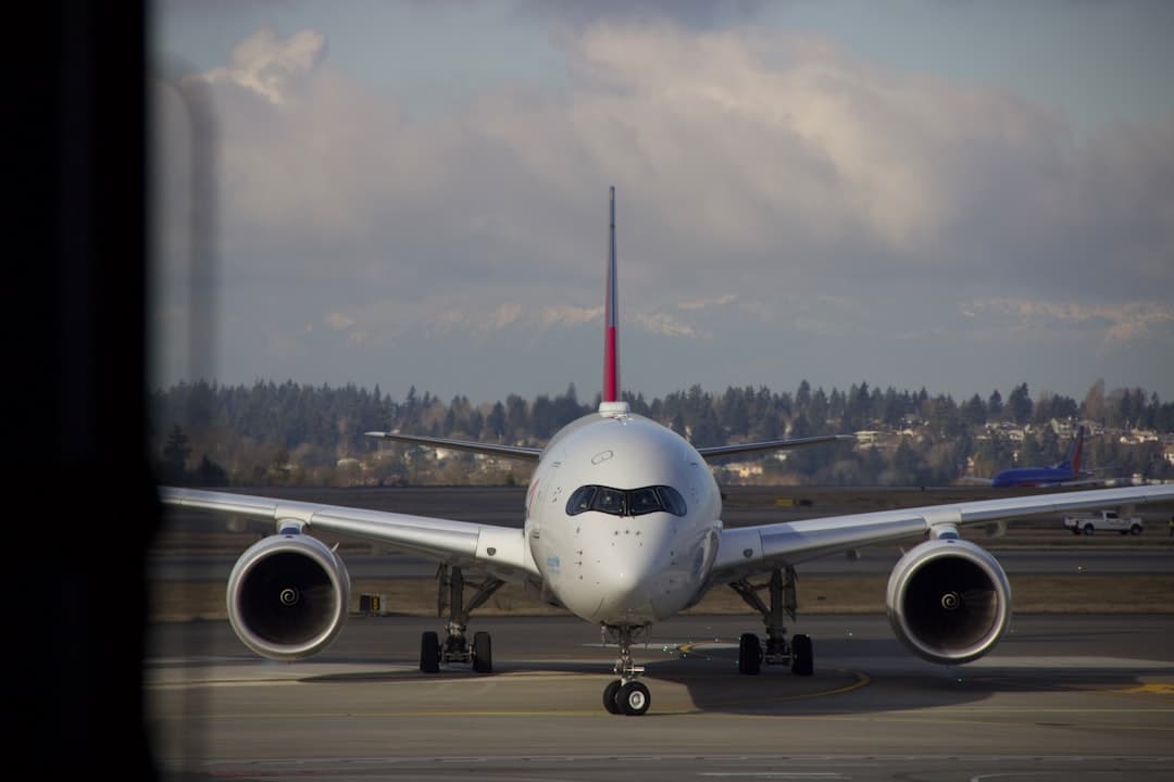 white passenger plane on airport during daytime — Photo by Cheng Huang on Unsplash