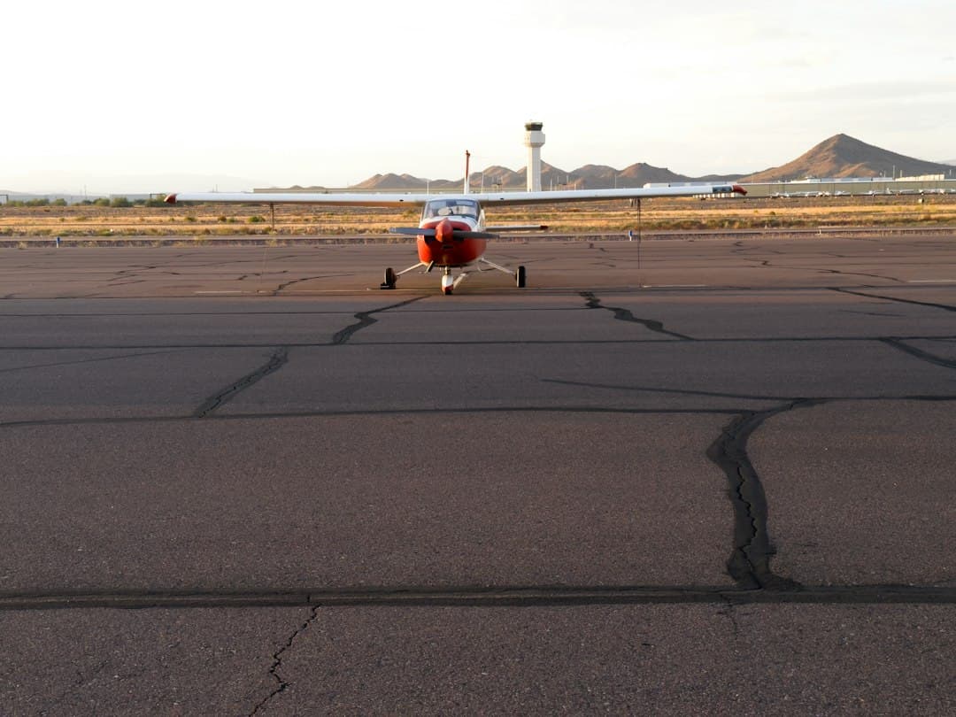 A small airplane sitting on top of an airport tarmac — Photo by Valorie Barela on Unsplash