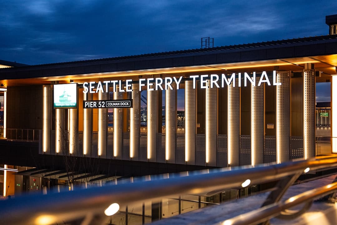 Seattle ferry terminal building at dusk — Photo by Josh Hild on Unsplash