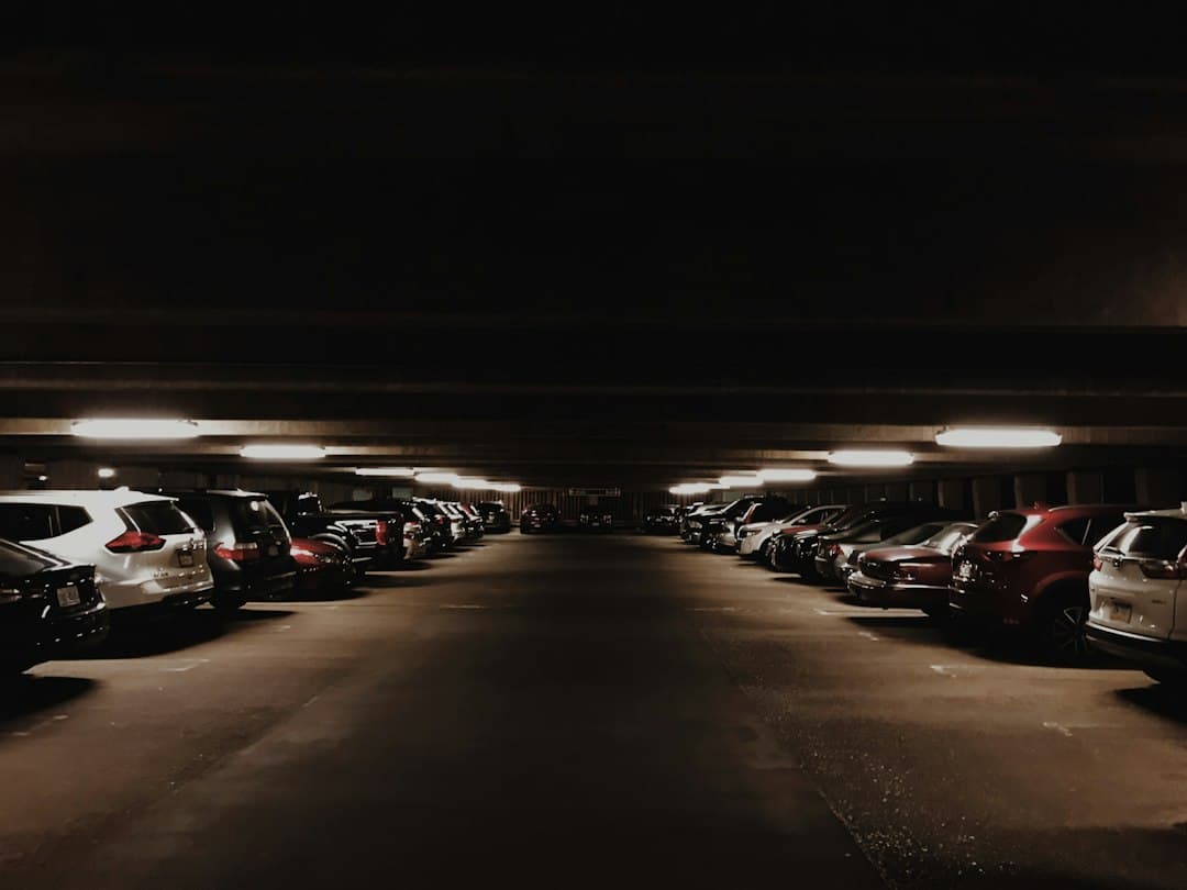 vehicles parked inside parking lot — Photo by Jordan Graff on Unsplash