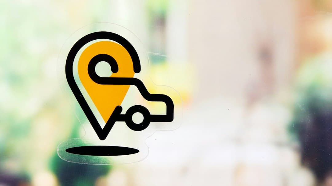 a yellow and black logo — Photo by Sticker it on Unsplash