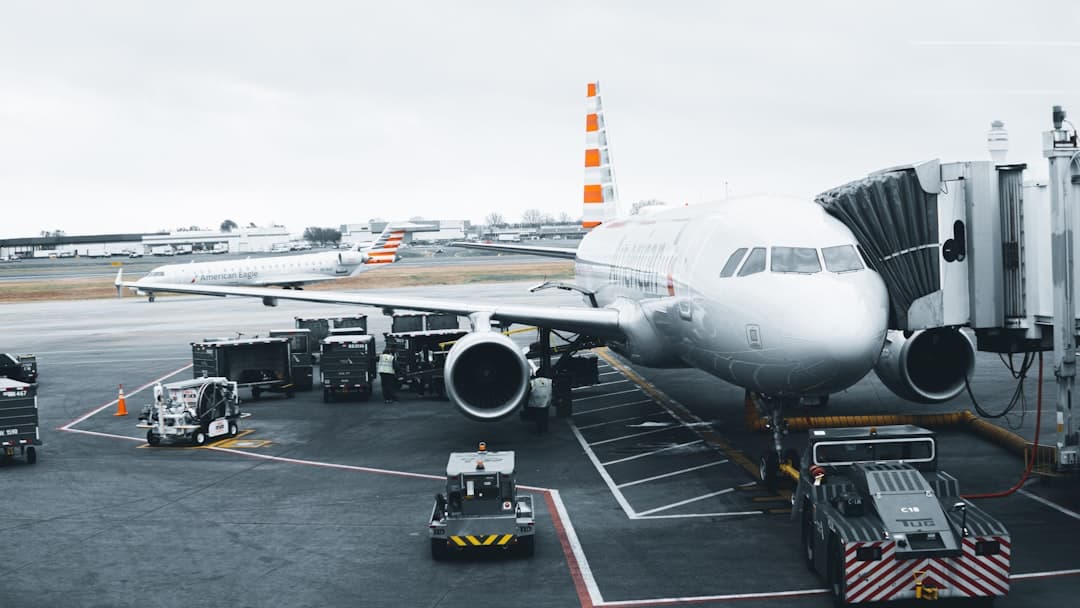 white airplane in airport during daytime — Photo by Asael Peña on Unsplash