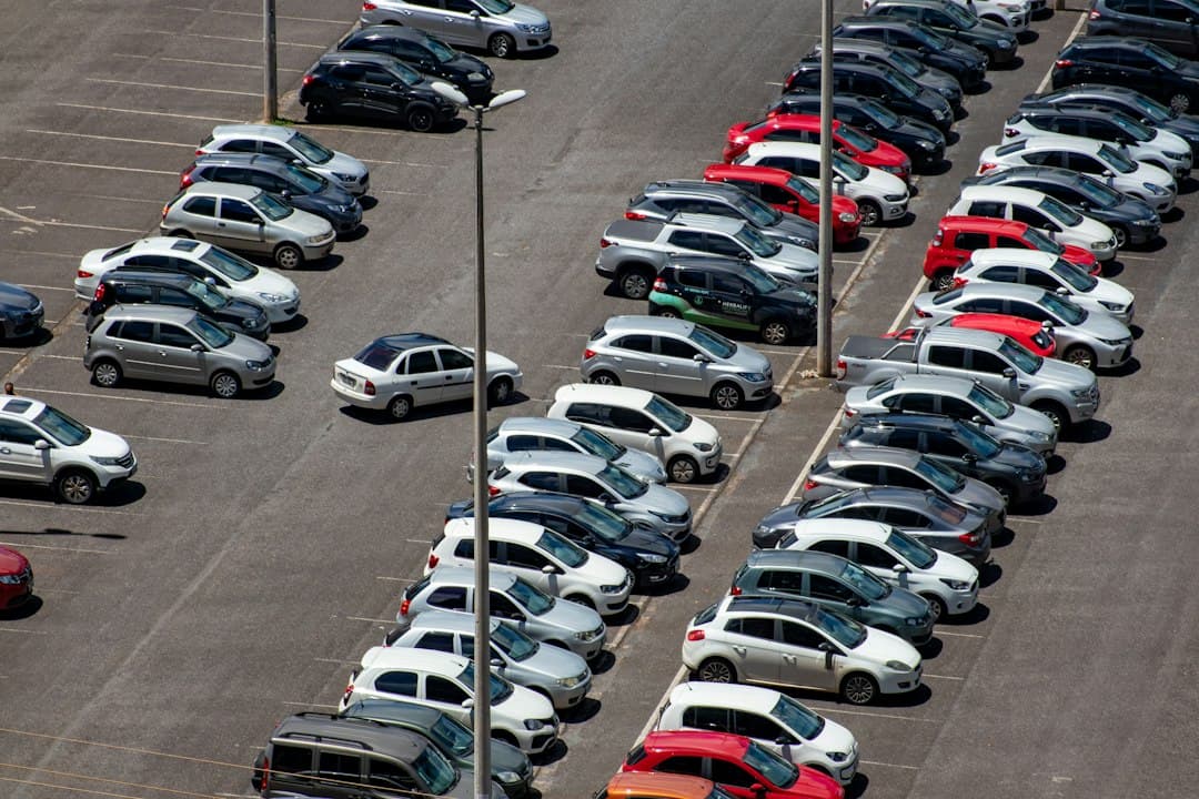 cars parked on parking lot during daytime — Photo by Vitor Paladini on Unsplash