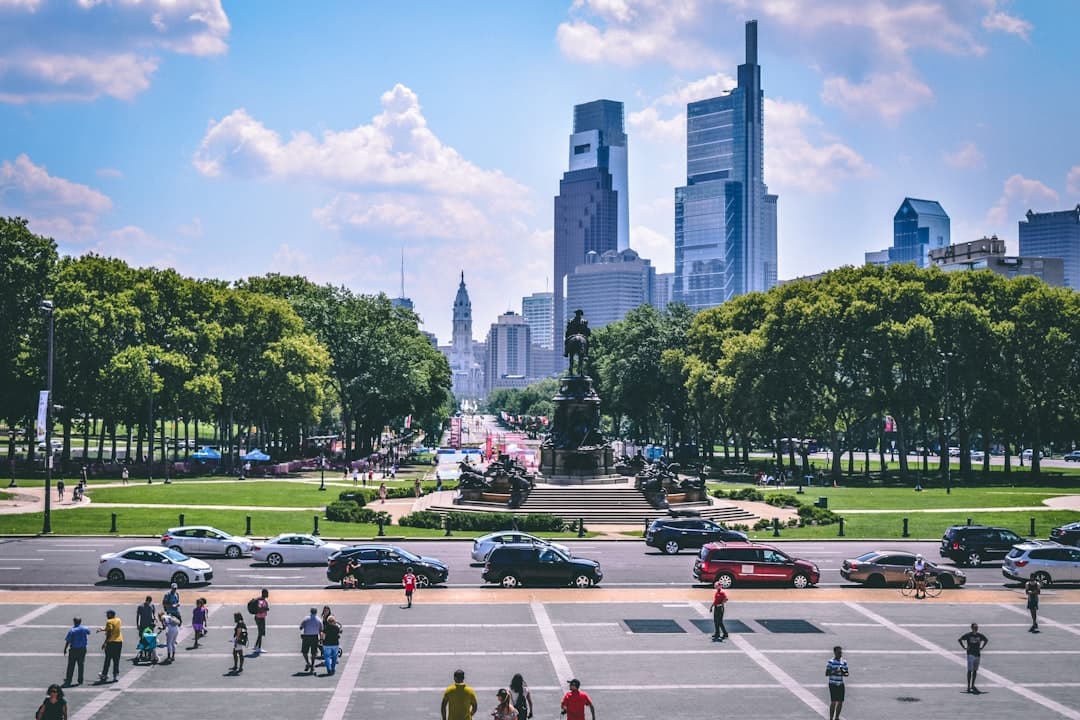 people walking on street near high rise buildings during daytime — Photo by Prasad Panchakshari on Unsplash