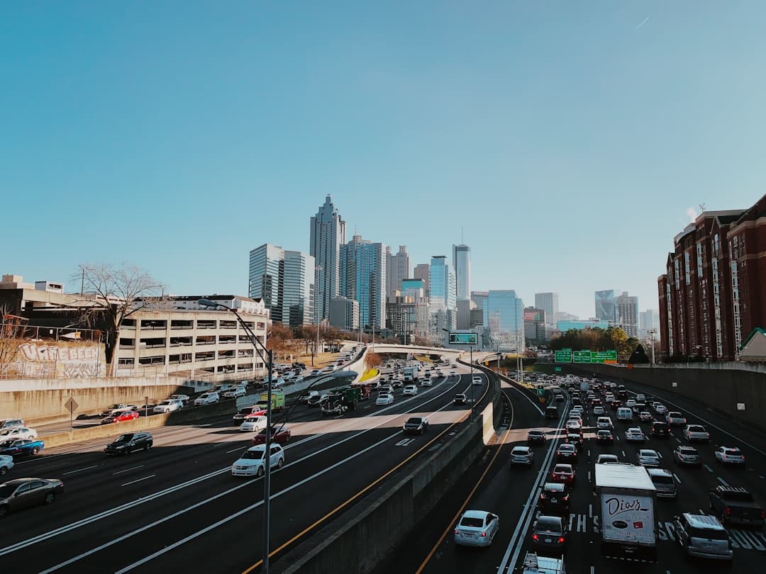 vehicles on road near buildings during daytime — Photo by Jason Weingardt on Unsplash