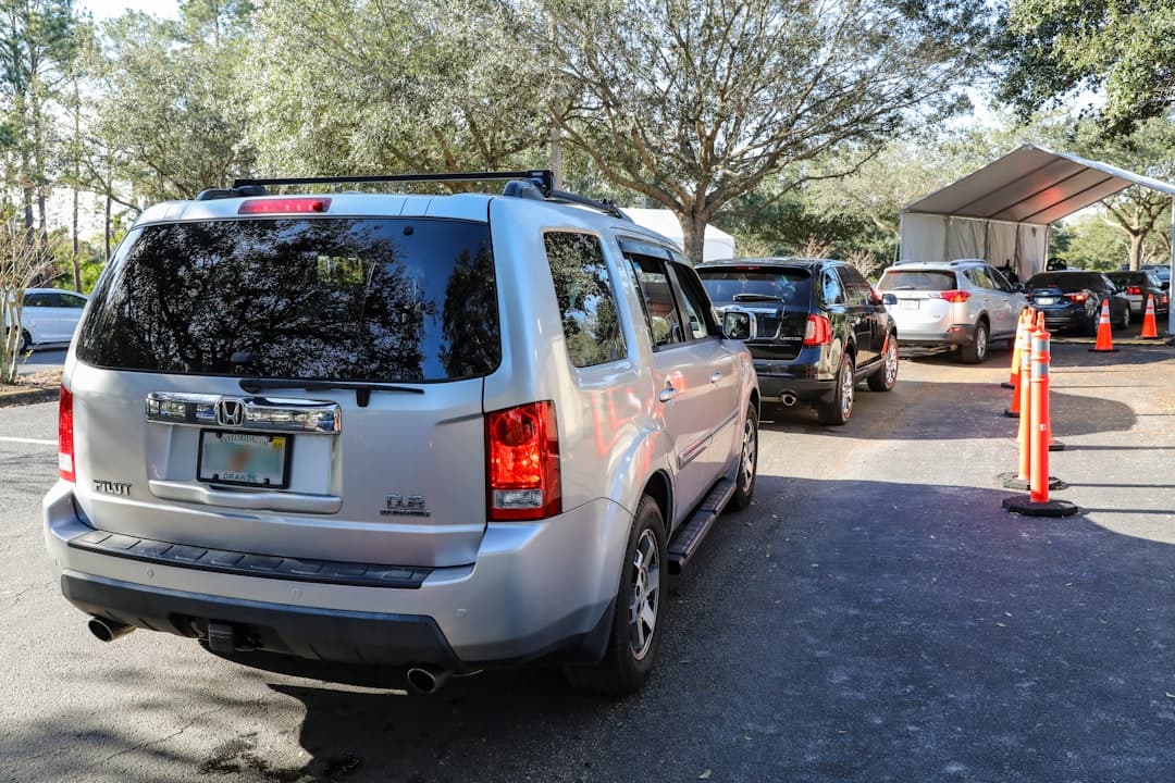 white suv parked on gray concrete road during daytime — Photo by Mick Haupt on Unsplash