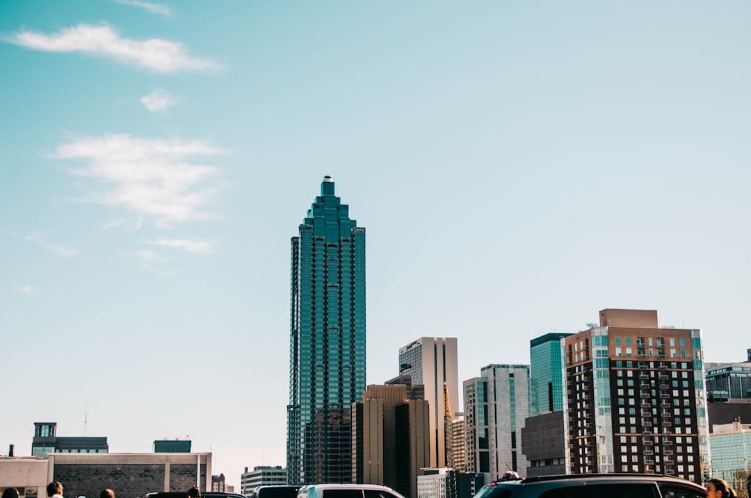 gray concrete building under white cloudy sky — Photo by Jessica Furtney on Unsplash
