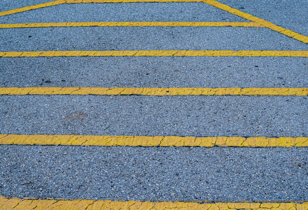 a road with yellow lines — Photo by Pete Alexopoulos on Unsplash