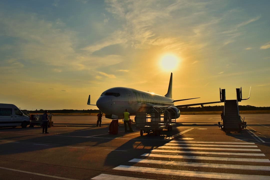 white airplane parked during daytime — Photo by Anna Gru on Unsplash