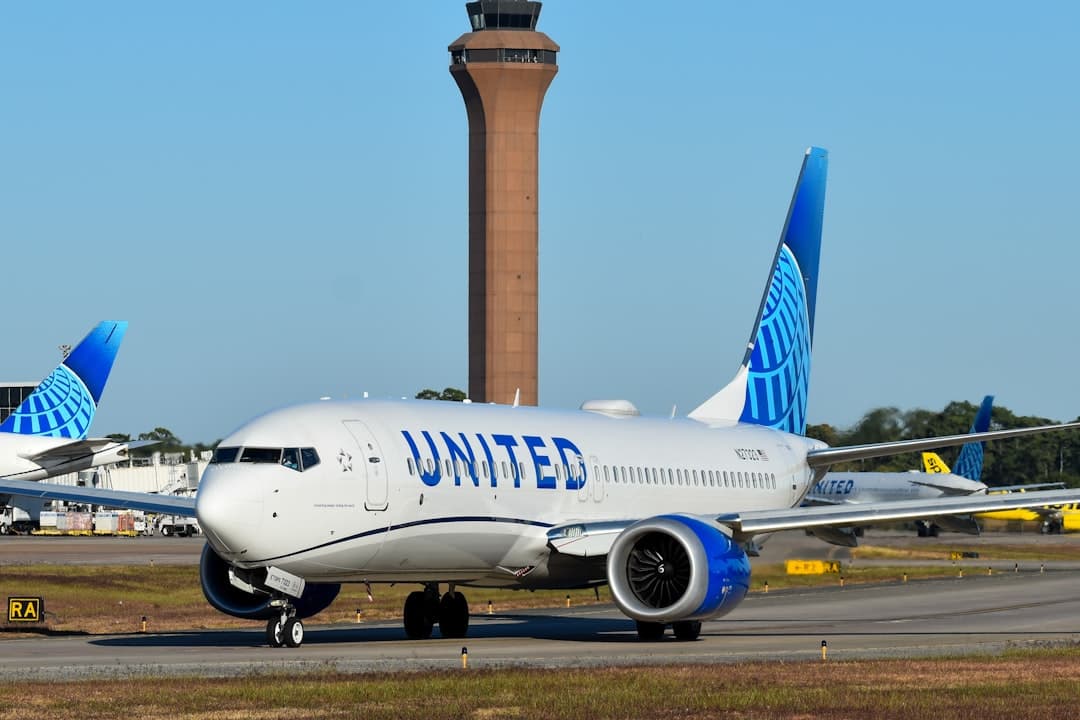 A large jetliner sitting on top of an airport runway — Photo by David Syphers on Unsplash