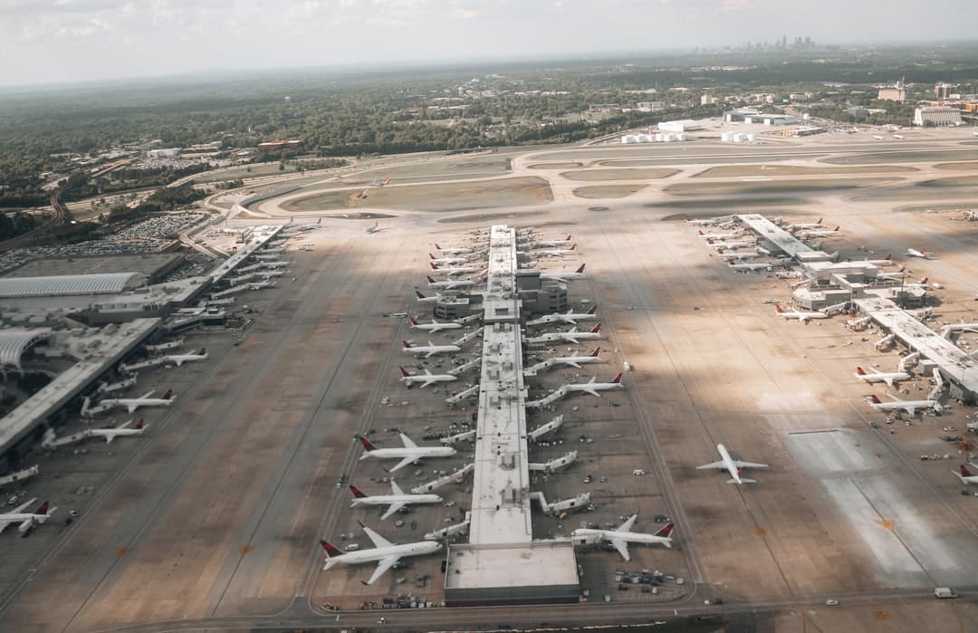 an aerial view of an airport with many planes — Photo by Nejc Soklič on Unsplash