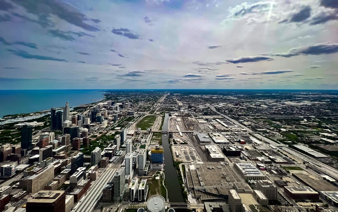 an aerial view of a city and the ocean — Photo by moh.thegreat on Unsplash