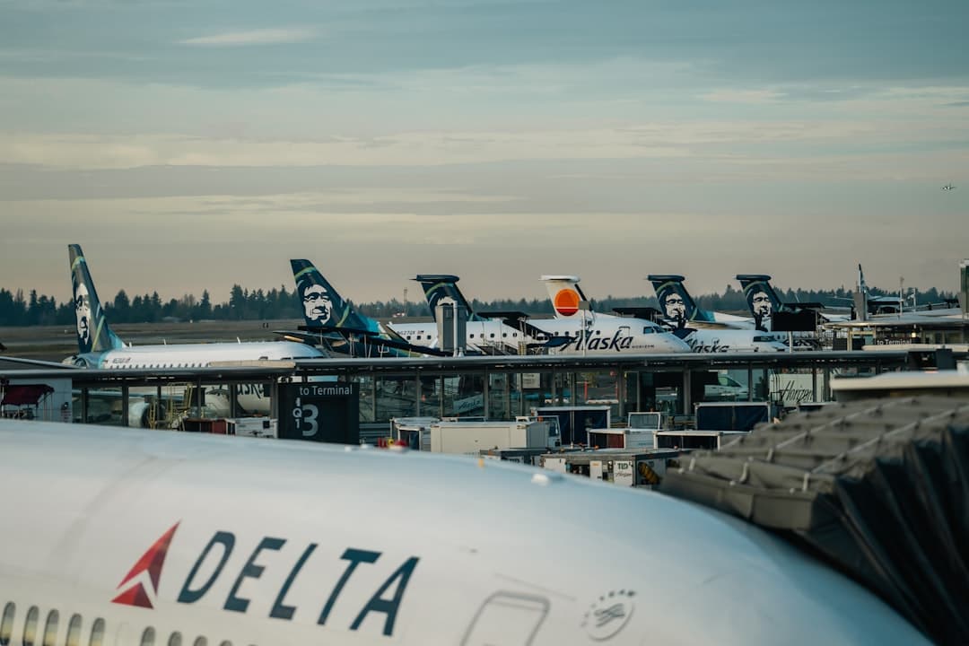 a group of airplanes parked at an airport — Photo by Jack Prommel on Unsplash