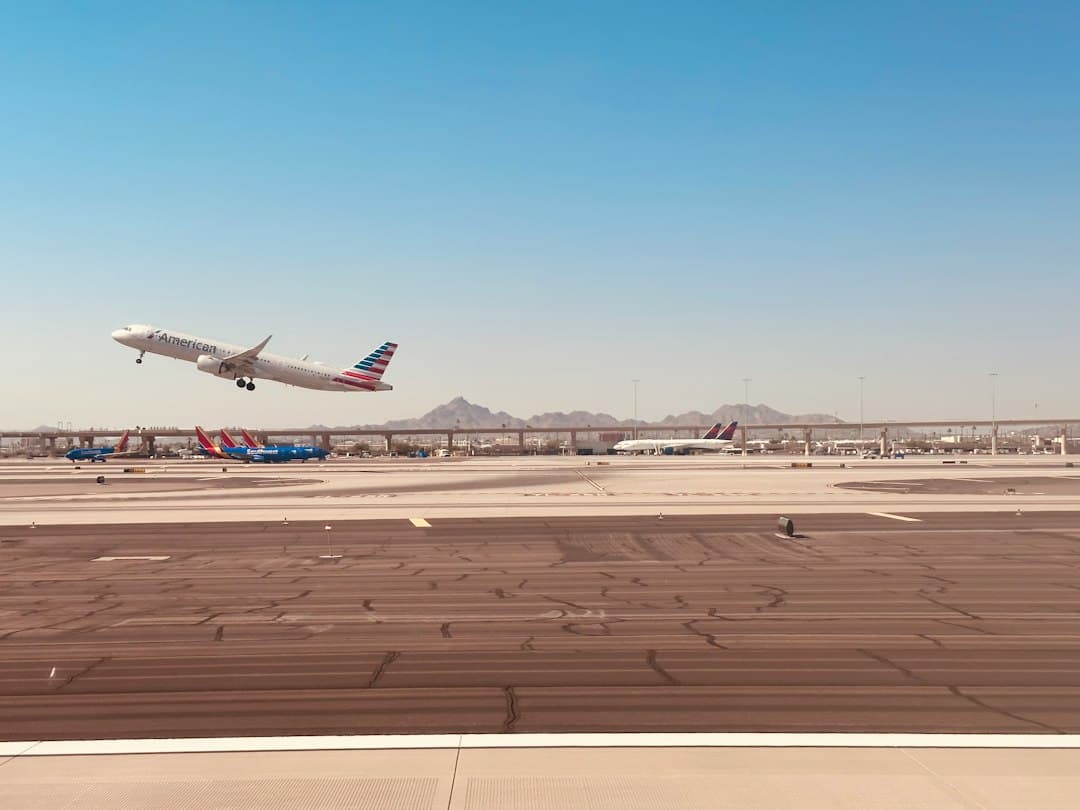 an airplane taking off from an airport runway — Photo by John Cameron on Unsplash