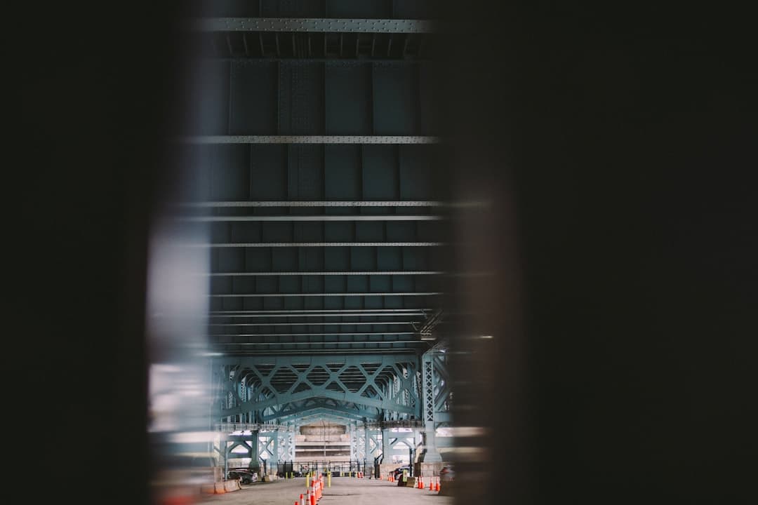 a view of a bridge from a moving vehicle — Photo by Susan Q Yin on Unsplash