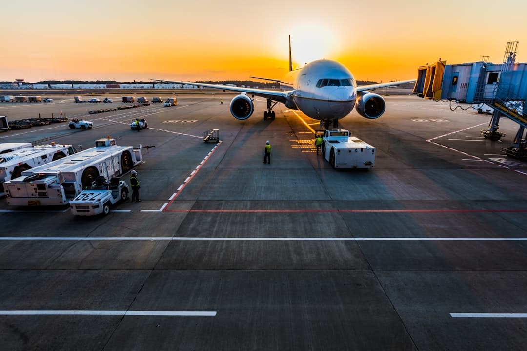 gray airplane on parking — Photo by Rocker Sta on Unsplash