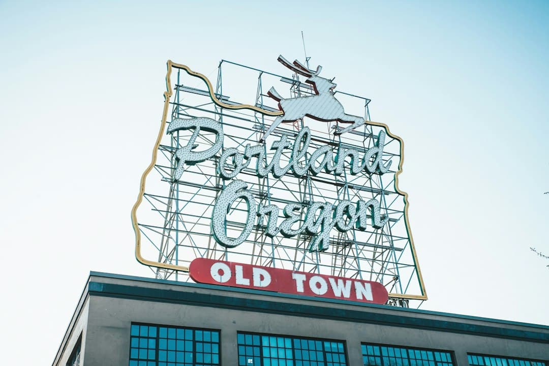 an old town sign on top of a building — Photo by Trang Nguyen on Unsplash