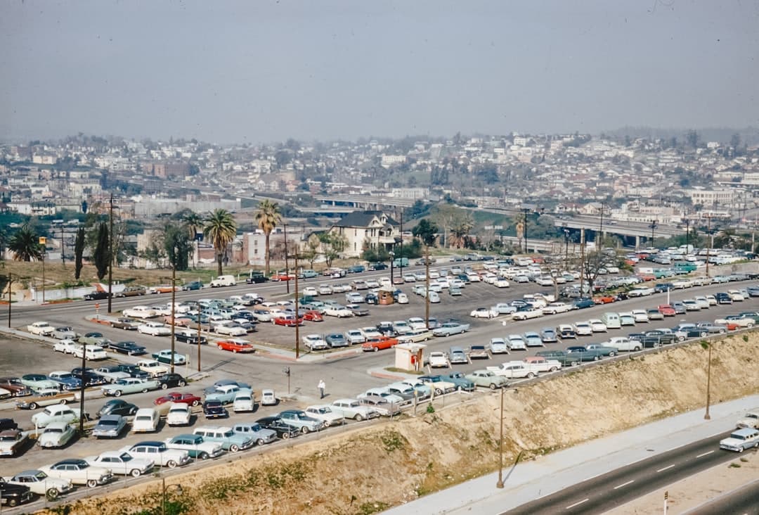 a parking lot filled with lots of parked cars — Photo by Annie Spratt on Unsplash