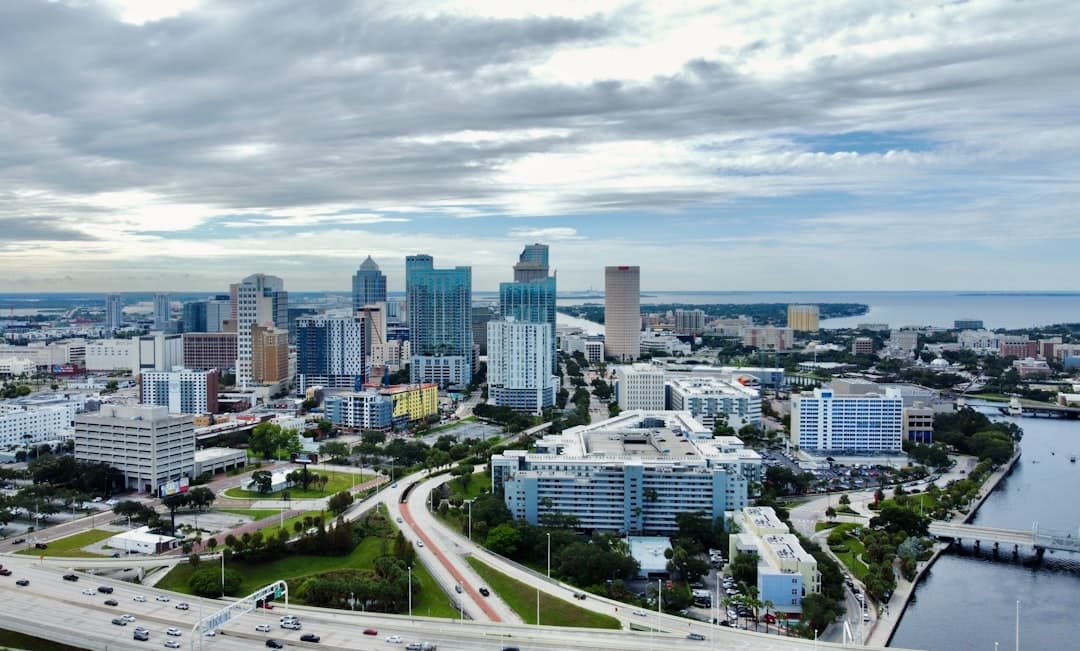 an aerial view of a city with tall buildings — Photo by Edgar Cotto on Unsplash