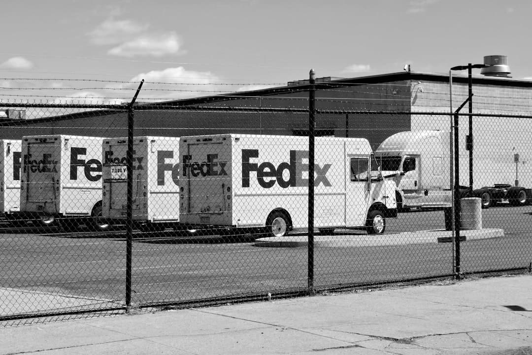 a black and white photo of a fedex truck — Photo by Sebastian Enrique on Unsplash