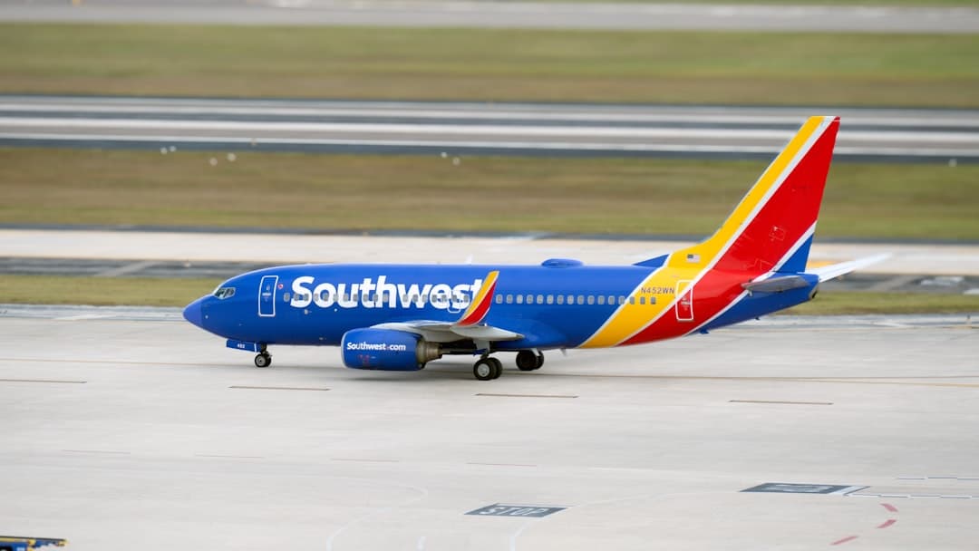 A southwest airlines plane on the runway at an airport — Photo by Hans Dorries on Unsplash
