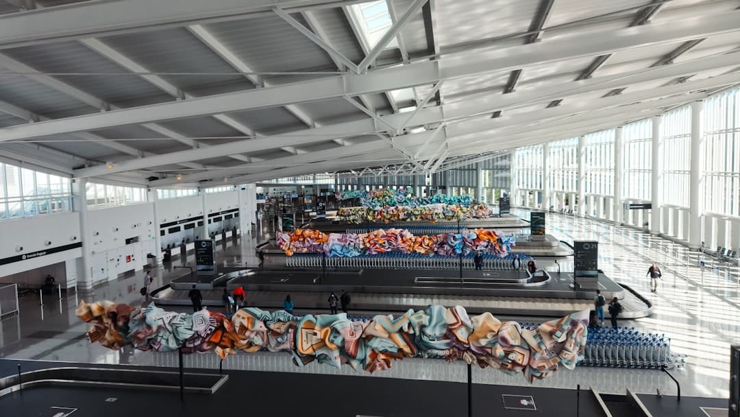 An airport terminal with lots of luggage on the conveyor belt — Photo by Zoshua Colah on Unsplash