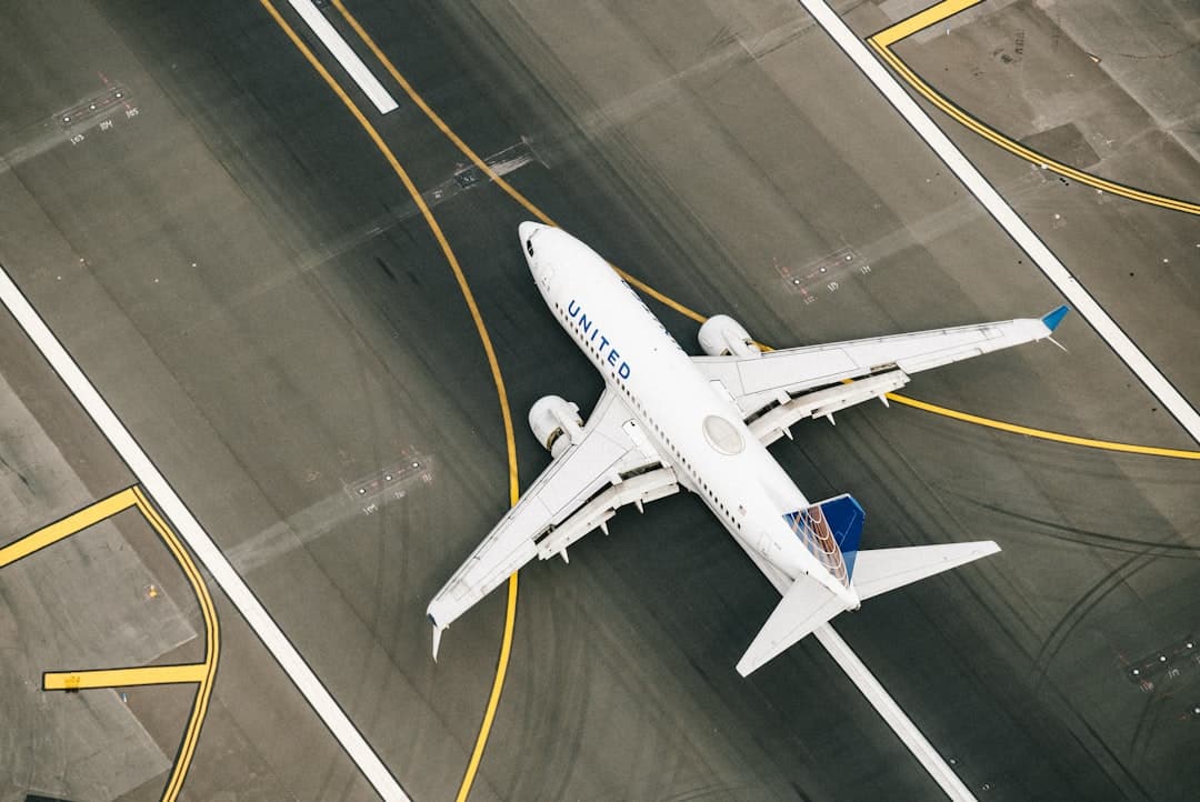 white and blue airplane on airport during daytime — Photo by Chris Leipelt on Unsplash