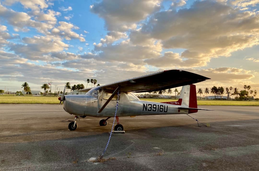 a small airplane sitting on top of an airport tarmac — Photo by Tomas Martinez on Unsplash
