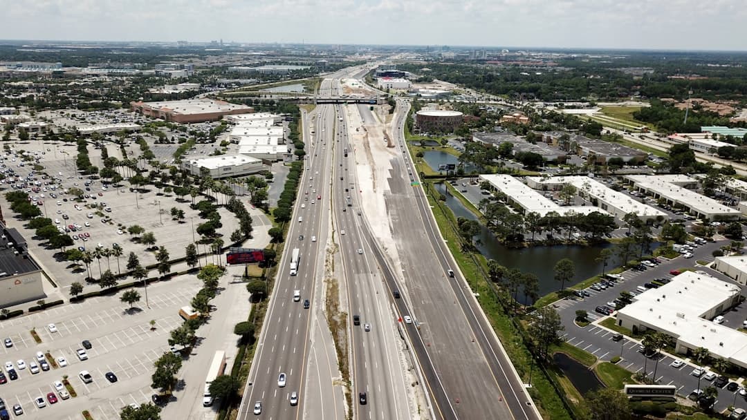 an aerial view of a highway and a city — Photo by Freysteinn G. Jonsson on Unsplash