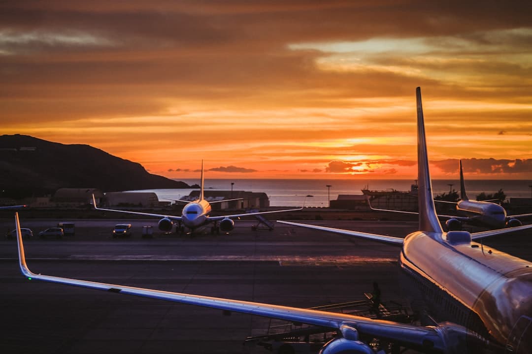 three airplane parked on road during golden hour — Photo by Yeray Sánchez on Unsplash
