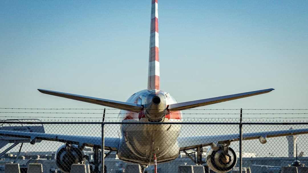 a large jetliner sitting on top of an airport tarmac — Photo by Jon McCallon on Unsplash