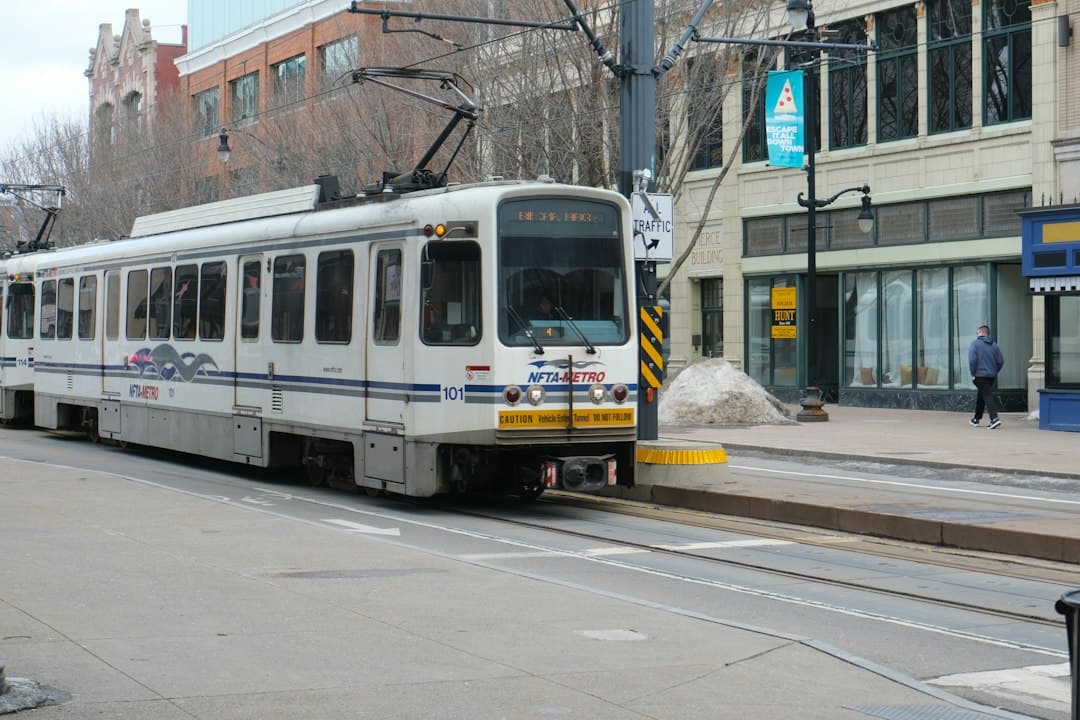 A light rail train is driving on city tracks — Photo by Anil Baki Durmus on Unsplash