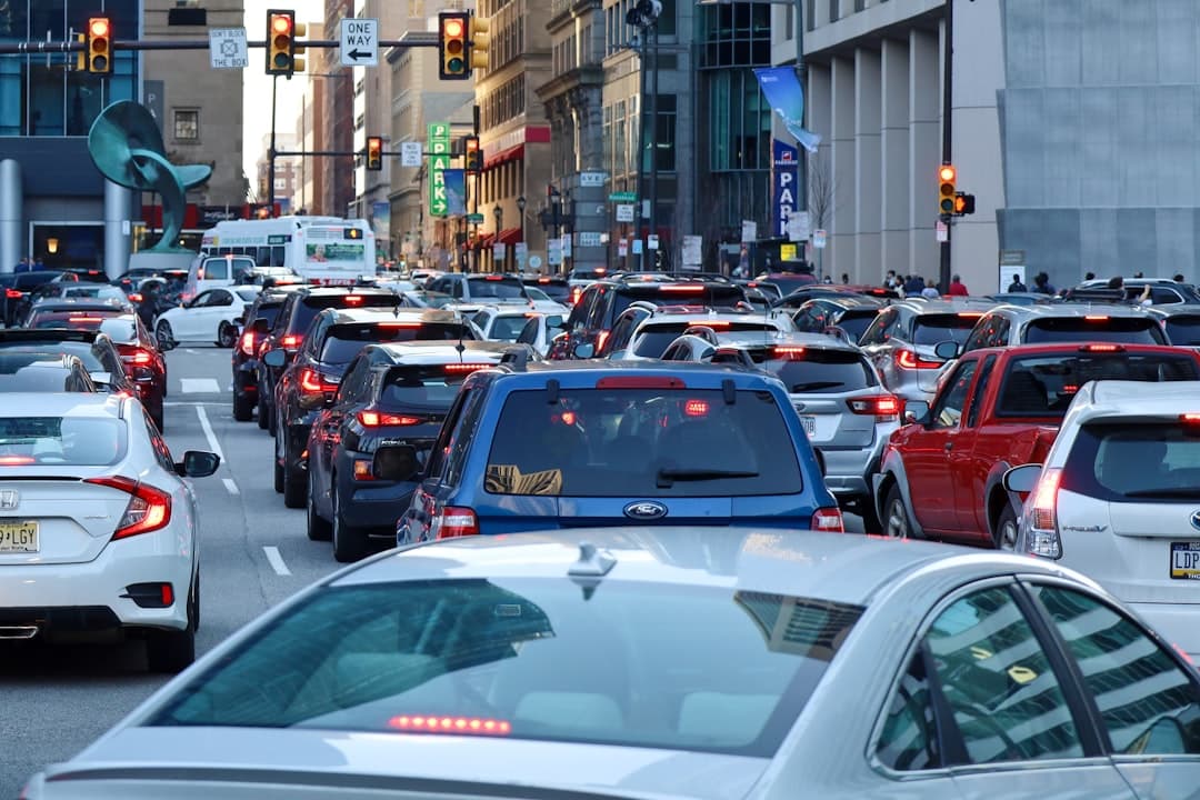 a busy city street filled with lots of traffic — Photo by Andrew Adams on Unsplash