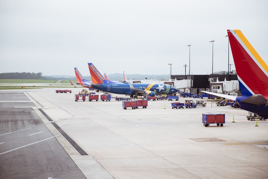parked passenger airplane on airport — Photo by Karl Magnuson on Unsplash