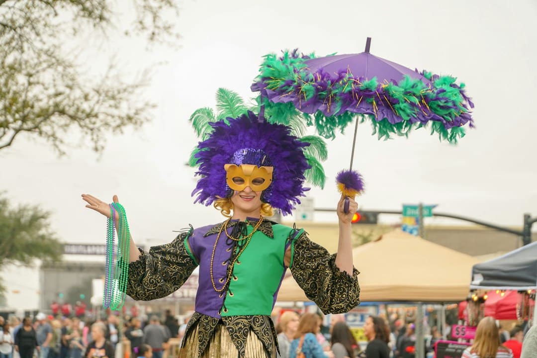 woman in purple and white dress holding umbrella — Photo by Thomas Park on Unsplash
