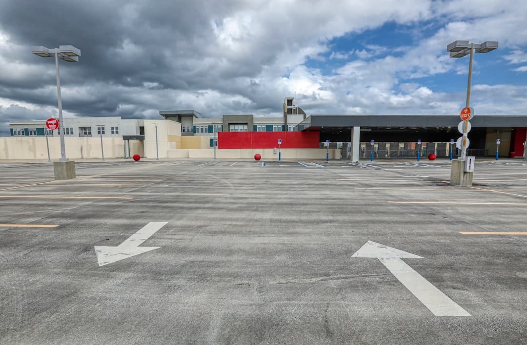 white and red building under white clouds during daytime — Photo by Mick Haupt on Unsplash