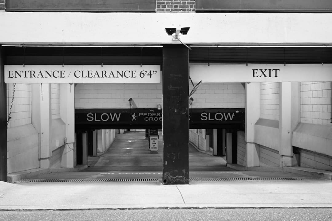 a black and white photo of an entrance to a building — Photo by Robert Guss on Unsplash