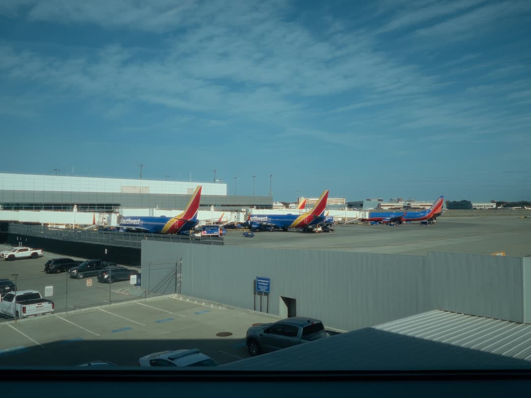 a group of airplanes parked at an airport — Photo by Reneé Thompson on Unsplash