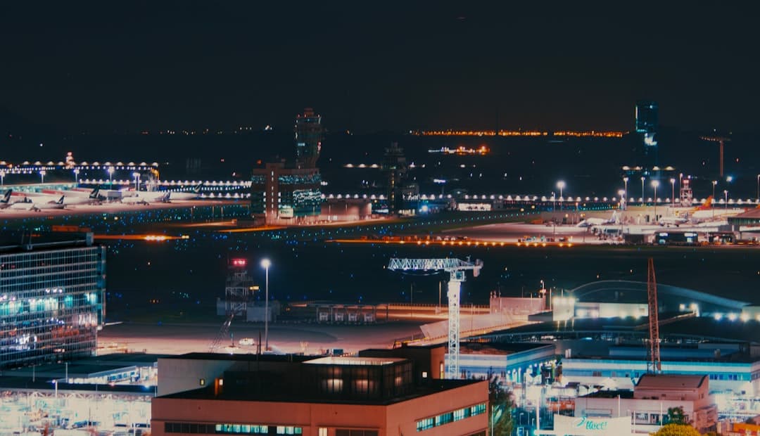 a view of a city at night from a high point of view — Photo by Sugarman Joe on Unsplash