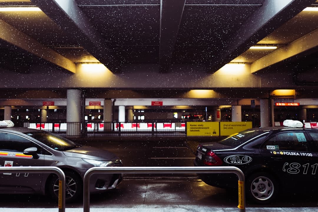 black sedan parked in parking lot — Photo by Ilona Celeste on Unsplash