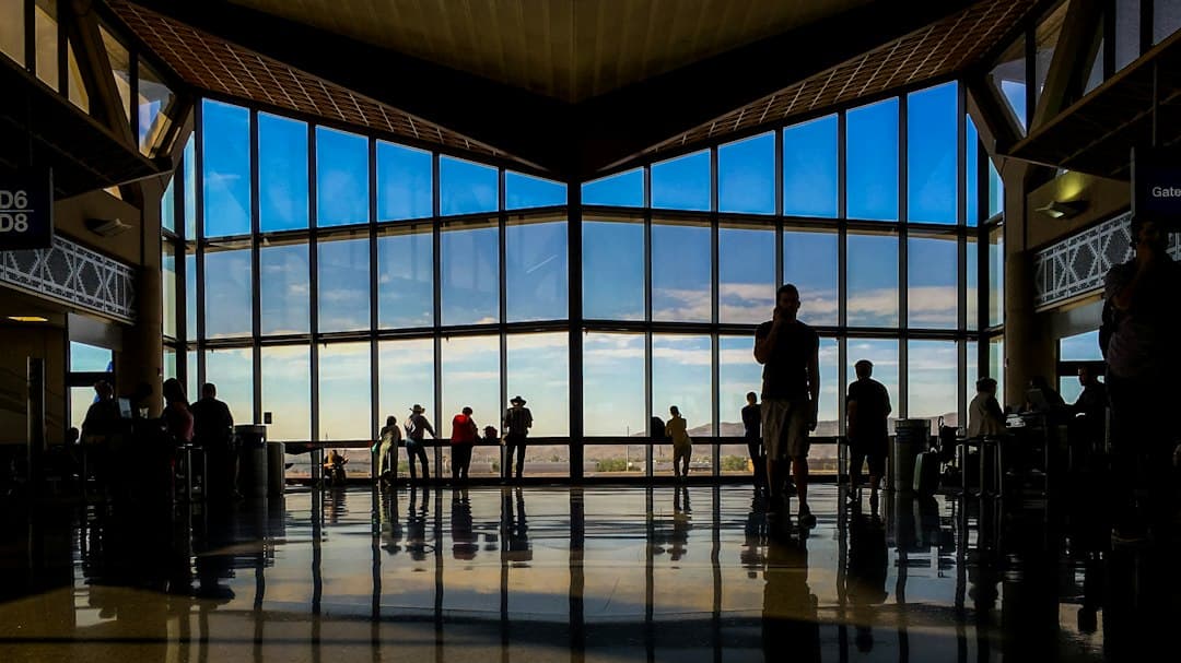 a group of people in a large building with large windows — Photo by Paul Cuoco on Unsplash