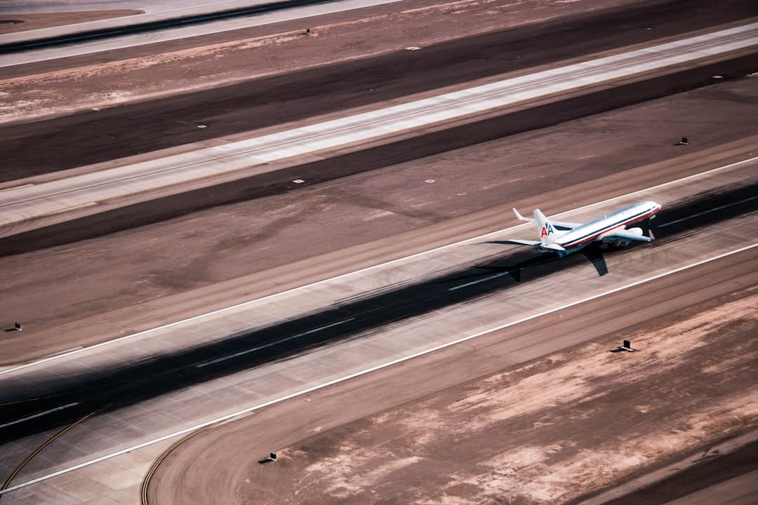 airplane landing on ground — Photo by Julio Rivera on Unsplash