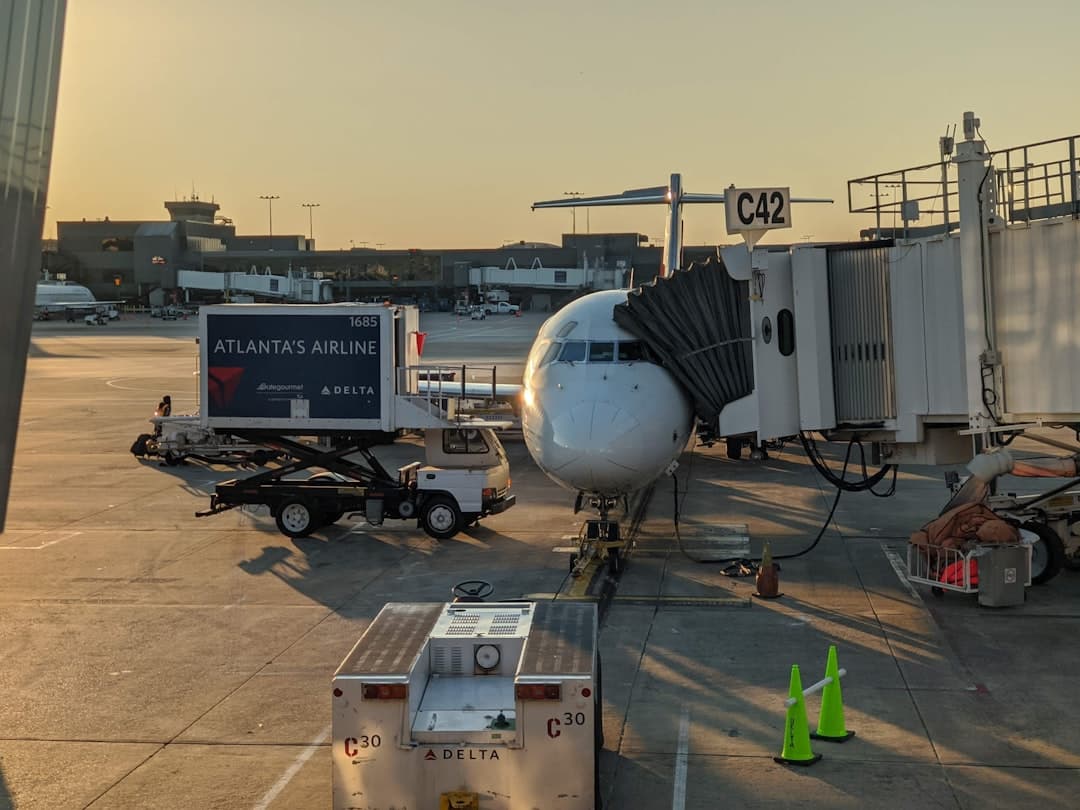 white and blue airplane on airport during daytime — Photo by Avery Murray on Unsplash