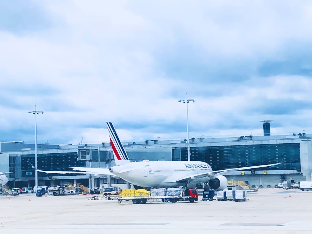 a large jetliner sitting on top of an airport tarmac — Photo by Sanjith Mayilsamy on Unsplash